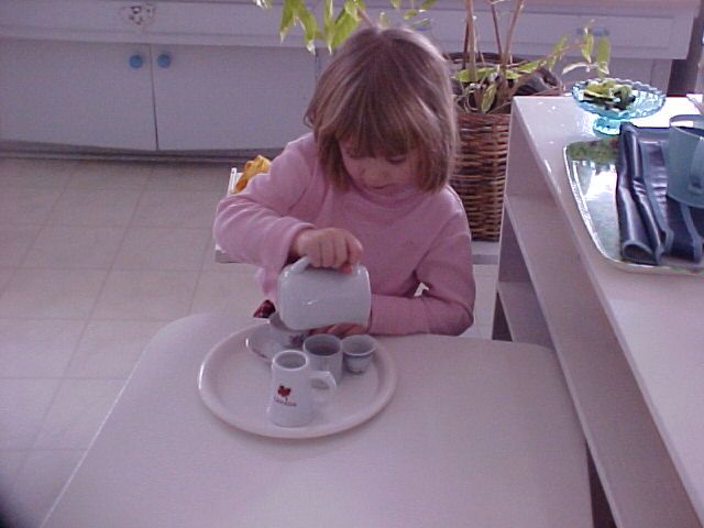 Girl pouring tea