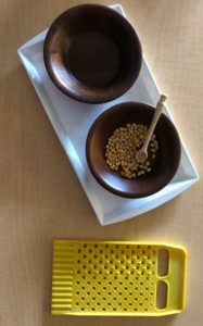 2 bowls with spoon and corn kernels